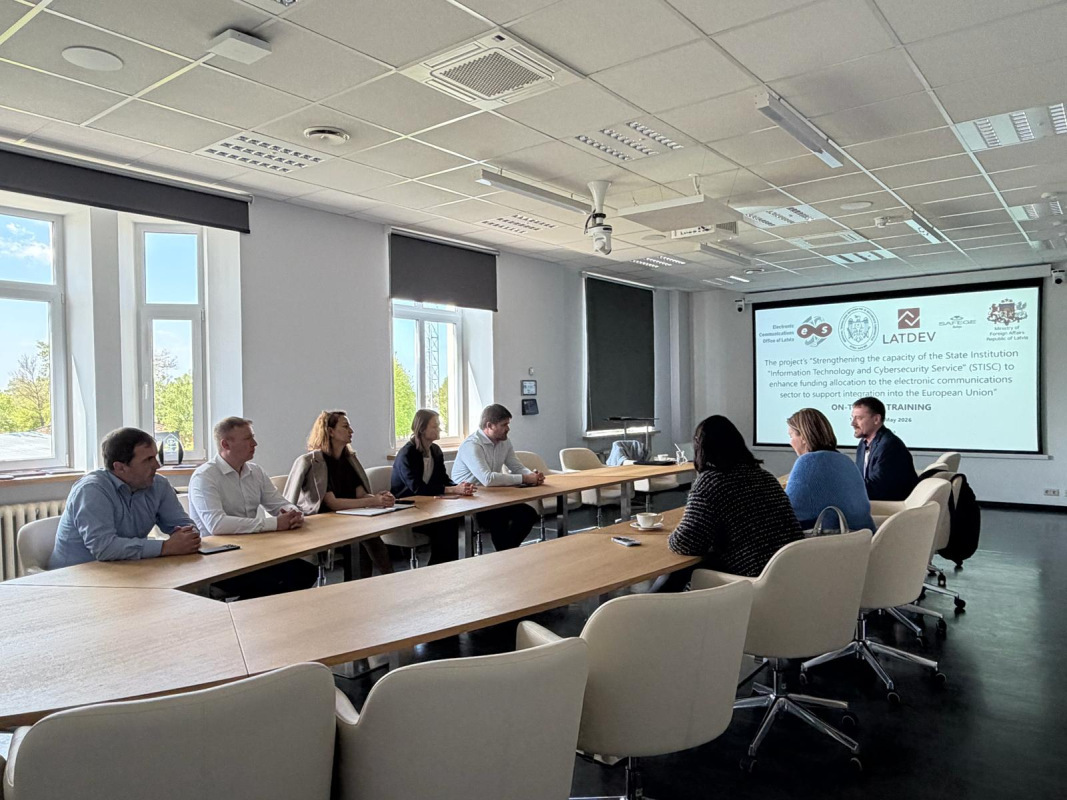 Representatives participating in a project session in a conference room.